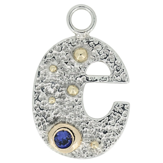 Silver letter 'e' pendant with gemstones on a white background