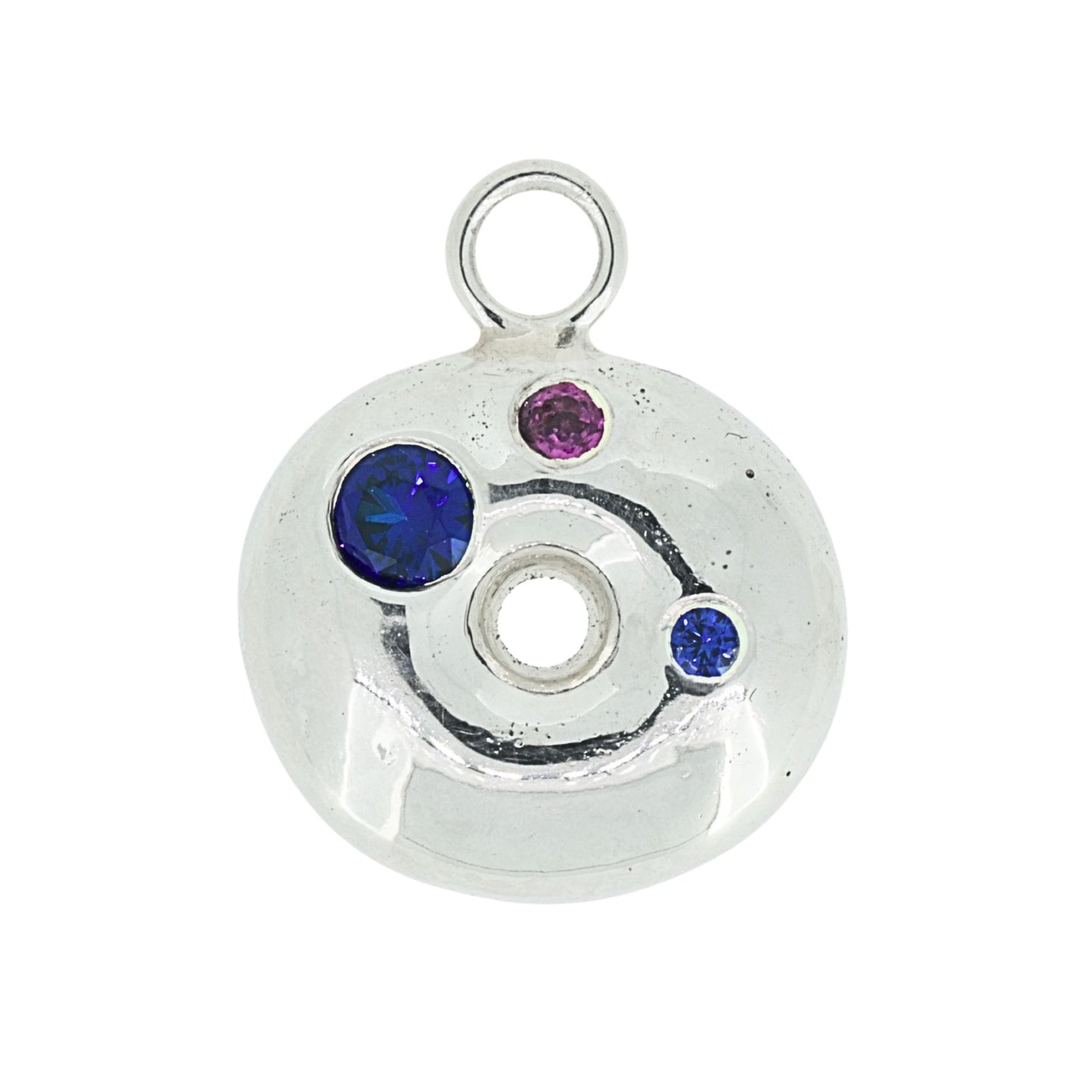 Silver donut pendant with blue sapphire and garnet gemstones on a white background