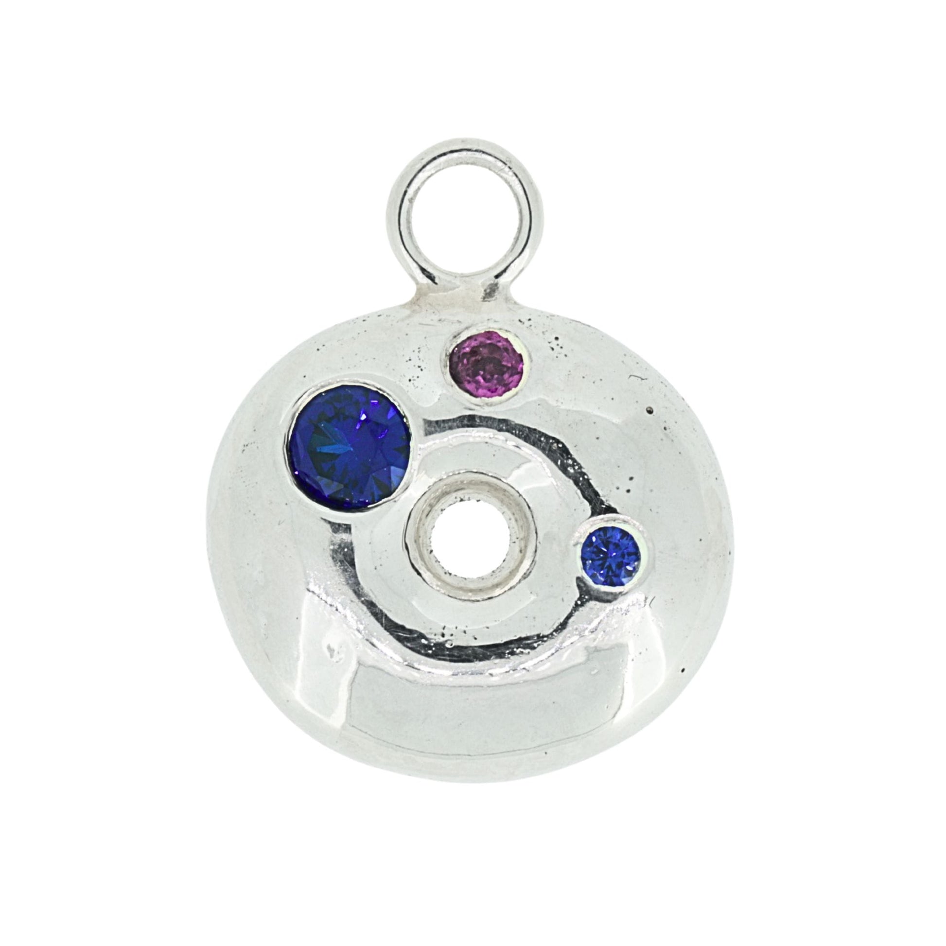 Silver donut pendant with blue sapphire and garnet gemstones on a white background