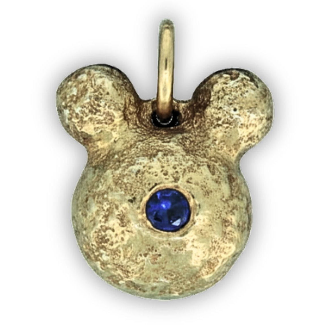 Gold pendant with a blue gemstone on a white background