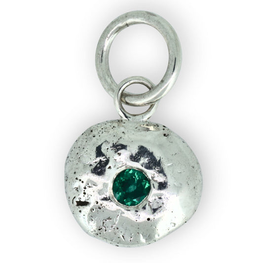 handcrafted emerald silver pendant organic shape close up