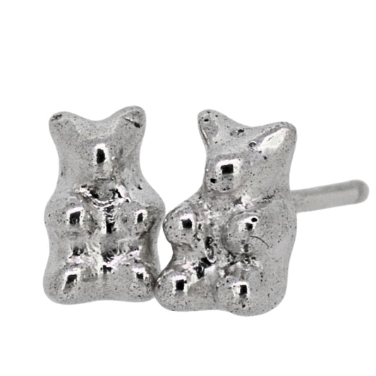 Silver gummy bear-shaped earrings on a white background